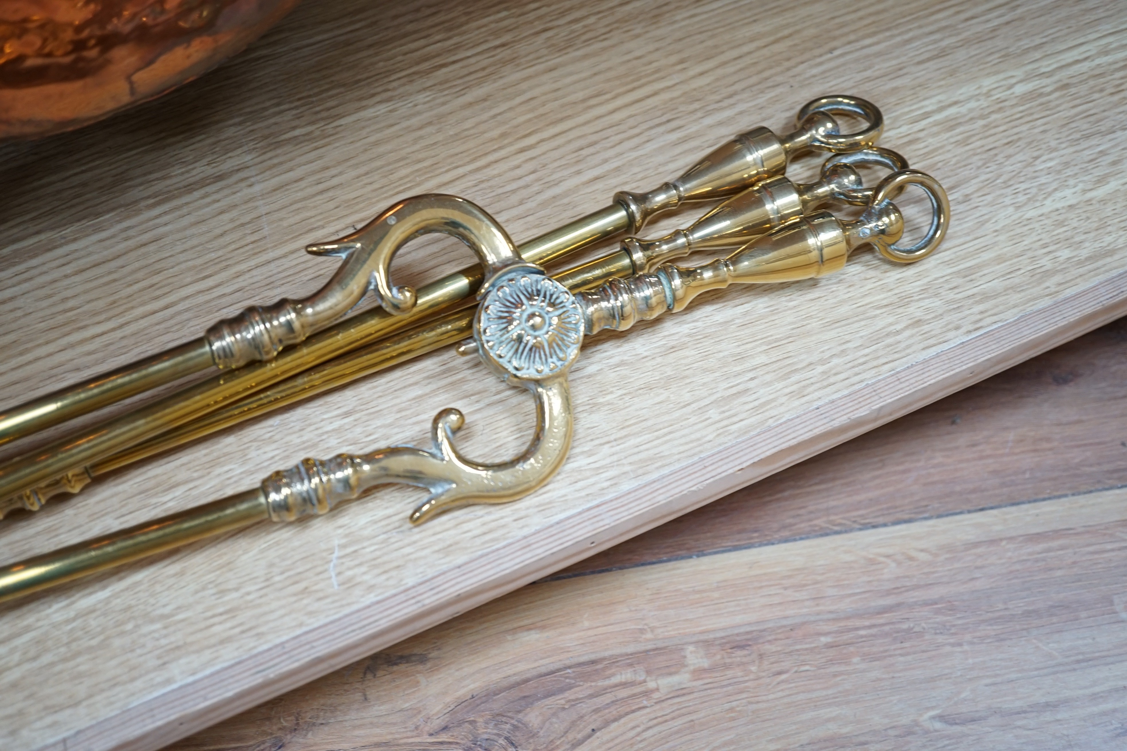 A set of three Victorian brass fire irons, a pair of fire dogs and a copper log bin